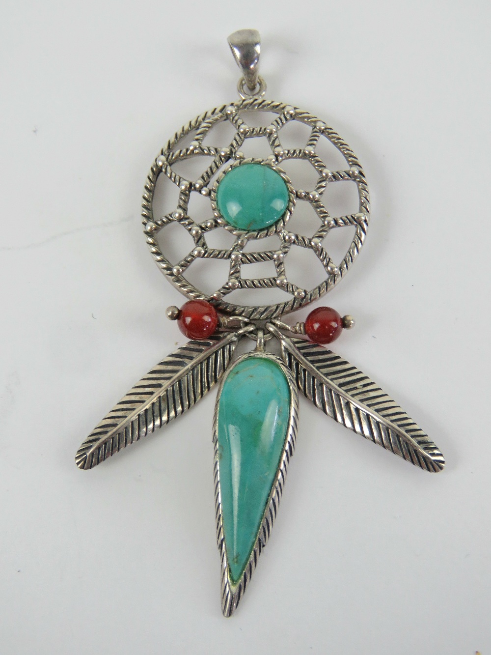 A large silver and turquoise Native American style dream catcher pendant, stamped 925 and