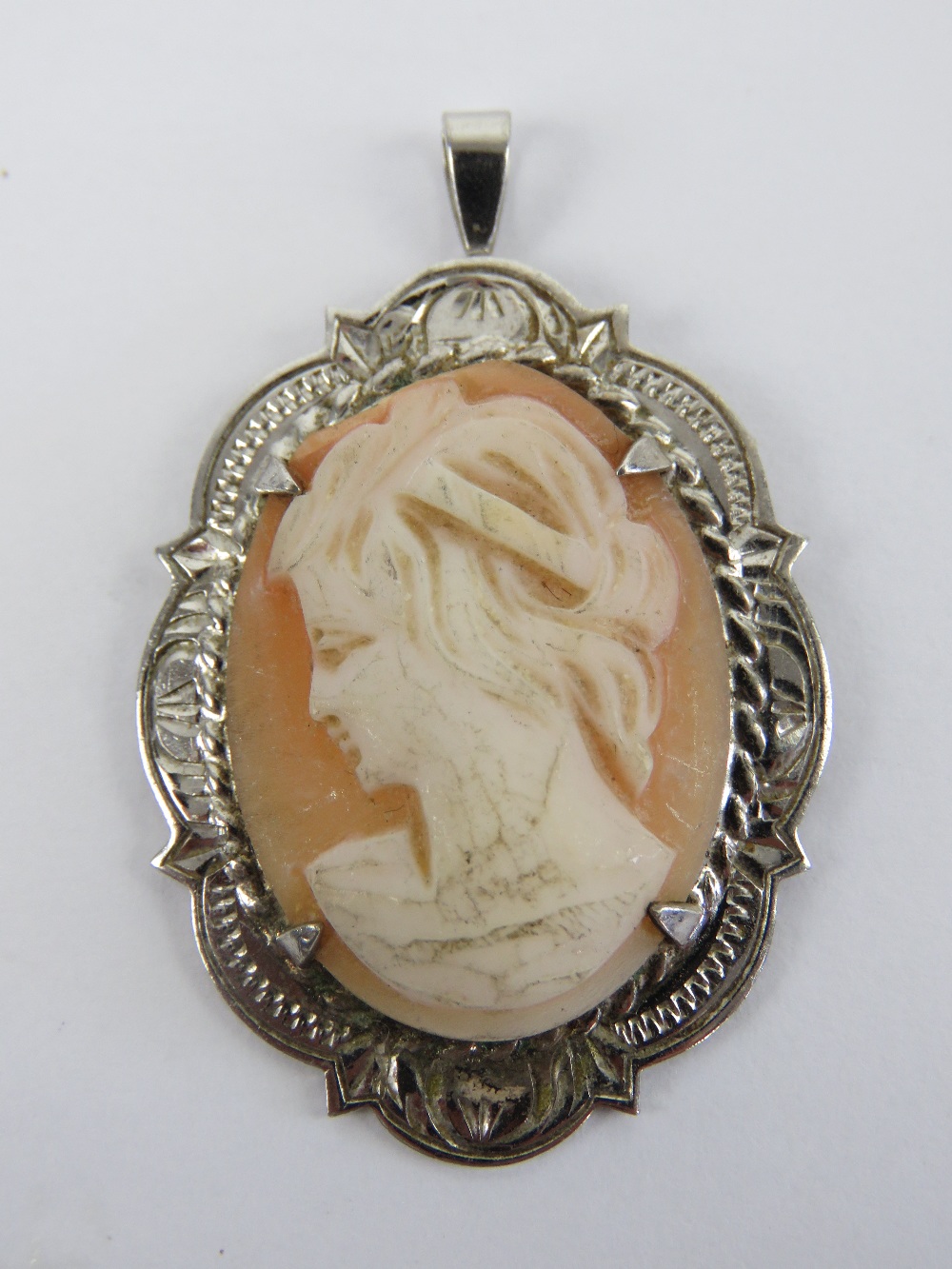 A HM silver pendant having carved shell female cameo portrait upon, 4cm inc bale.