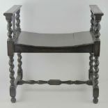 A stained oak window seat having Barley twist legs, 60 x 38 x61cm.