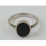 A silver and onyx signet ring, unengraved, size K-L.