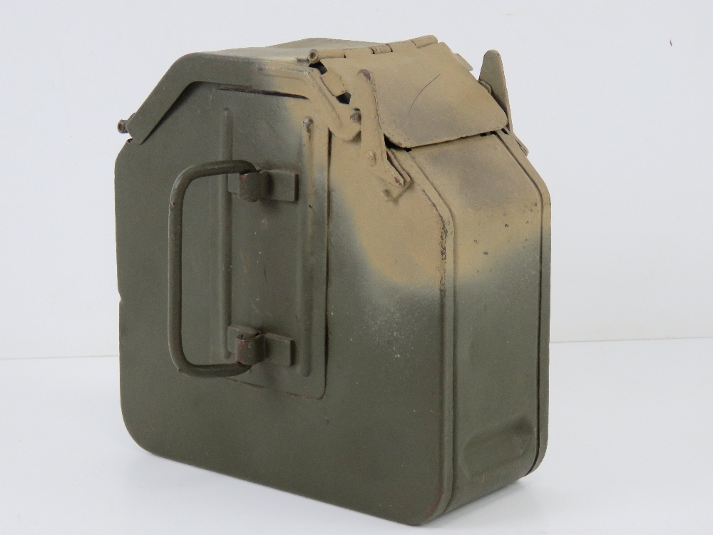 A WWII German MG34 75rd magazine, repainted, dated 1941, makers mark indistinct (brc?).