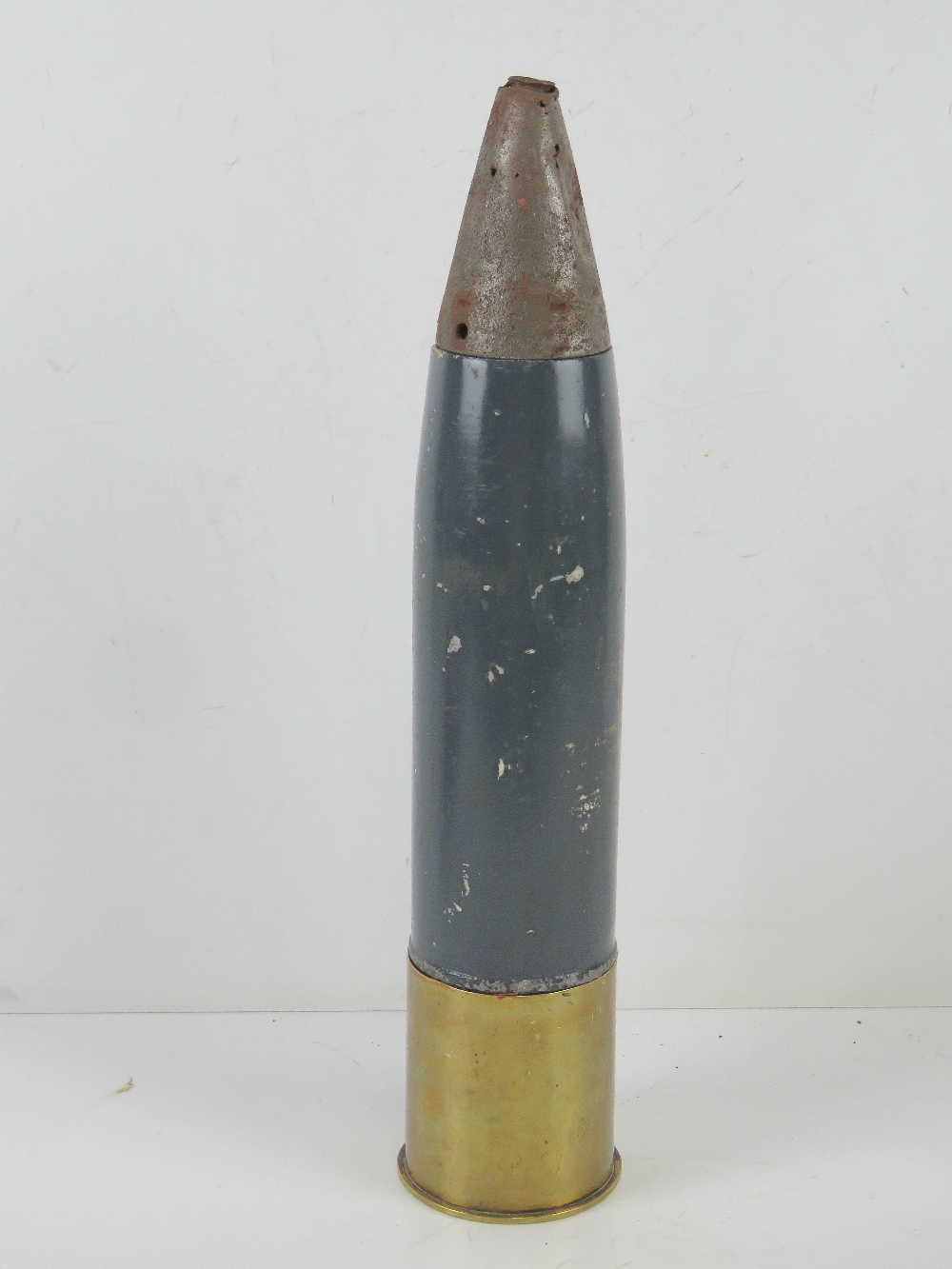 An inert WWII German LG18 75mm mountain gun round, dated 1942 and having marks upon.