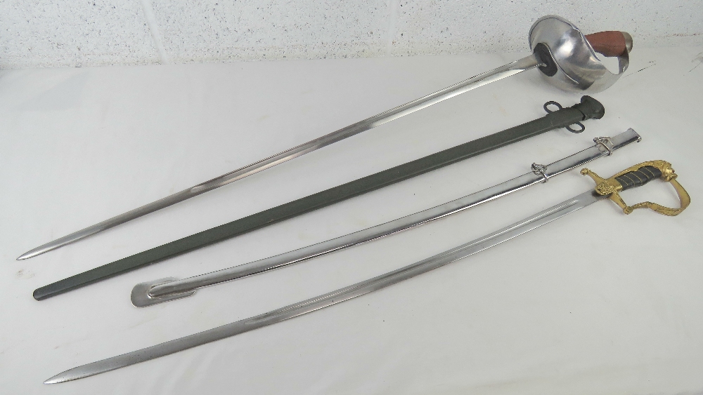 Two reproduction swords; British Cavalry and German with Lions head design, each with scabbard.