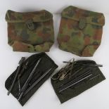 Two US army cleaning pouches together with two Australian Army magazine pouches.