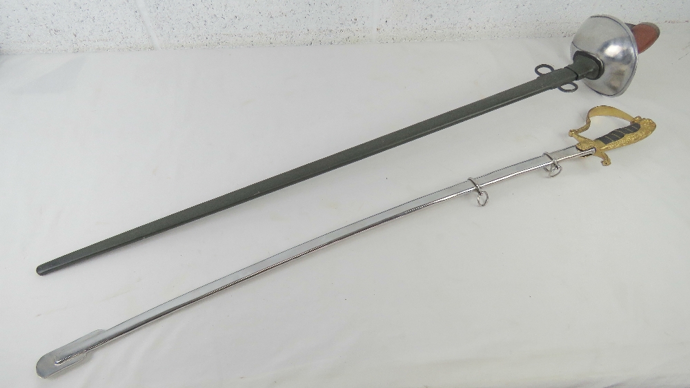 Two reproduction swords; British Cavalry and German with Lions head design, each with scabbard. - Image 2 of 4