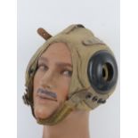 A US AN-H-15 soft flight helmet with chin strap.