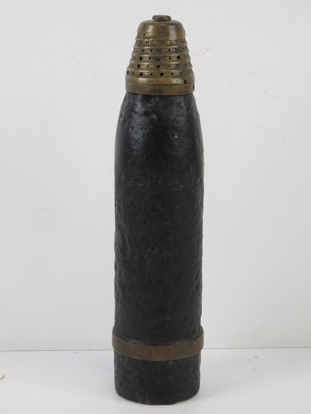 An inert WWI French 75mm Anti-Aircraft Round with unfired drive band.