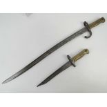 A French Chassepot 1866 pattern bayonet, together with a converted 1866 fighting knife. Two items.