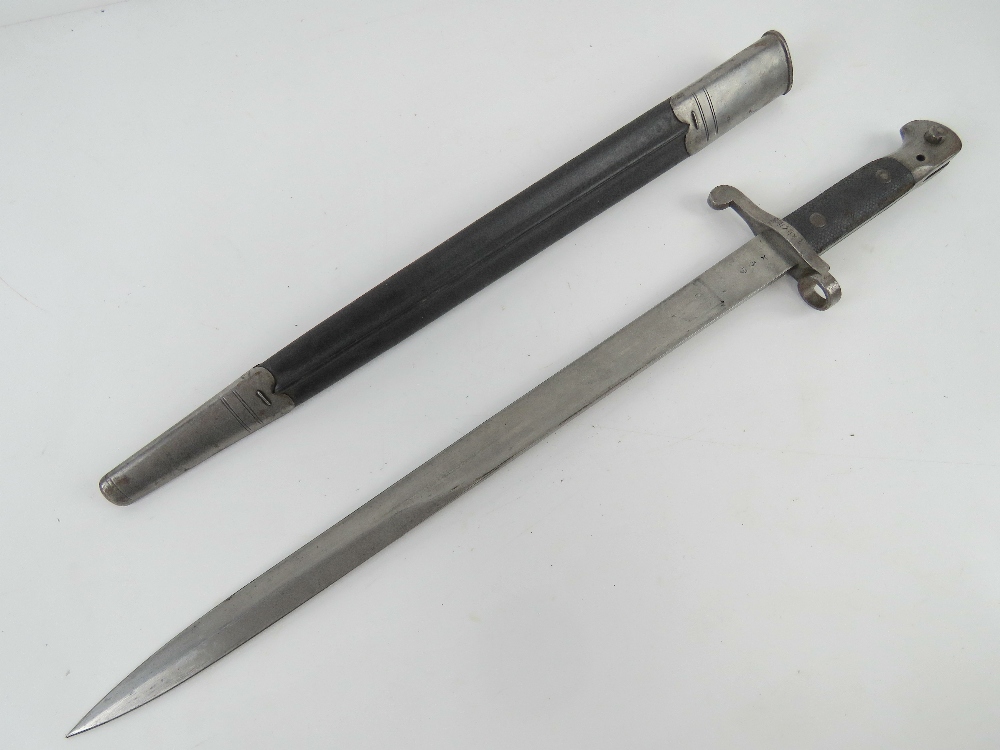 A Martini Henry sword bayonet with scabbard, dated 1894 with WD markings and numbered 10405.