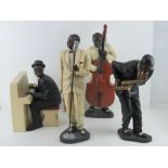 A contemporary set of four jazz band figurines inc singer, saxophone player,
