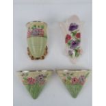 A quantity of assorted ceramic wall pockets;