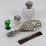 An HM silver dressing table set comprising hand mirror, rouge pot, perfume bottle and comb,