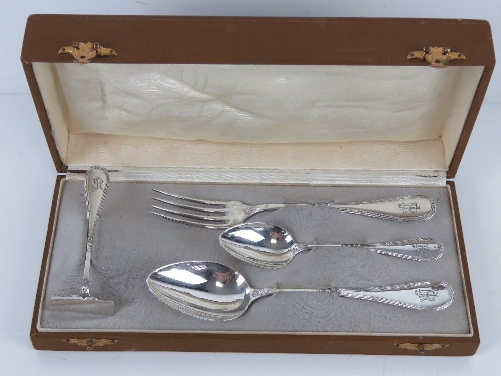 A German silver Christening set in original fitted box comprising fork, spoon, teaspoon and pusher,