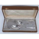 A German silver Christening set in original fitted box comprising fork, spoon, teaspoon and pusher,