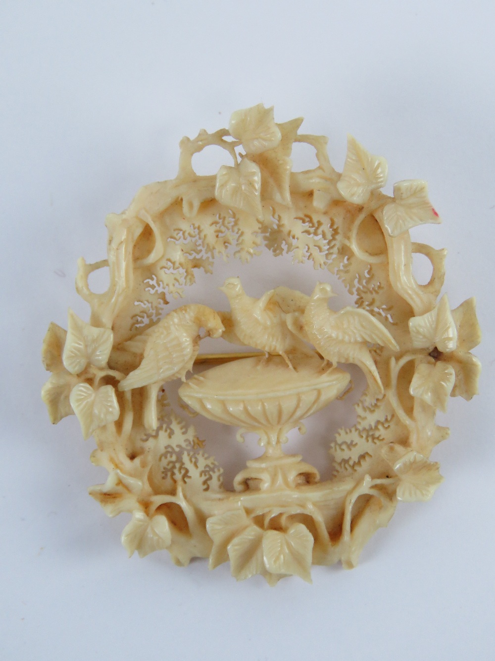 A superbly detailed 19th century carved ivory brooch having central Pliny doves stood upon a - Image 2 of 4