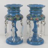 A pair of Bohemian hand painted glass lustre's having clear crystal suspended from the opaque blue
