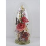 A 'captive garden' by Michael R Curzon having flowers and butterfly within, standing 30cm high.