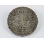 An 1887 Victoria half crown coin mounted for use as a brooch, 3.2mm dia, 14.9g.