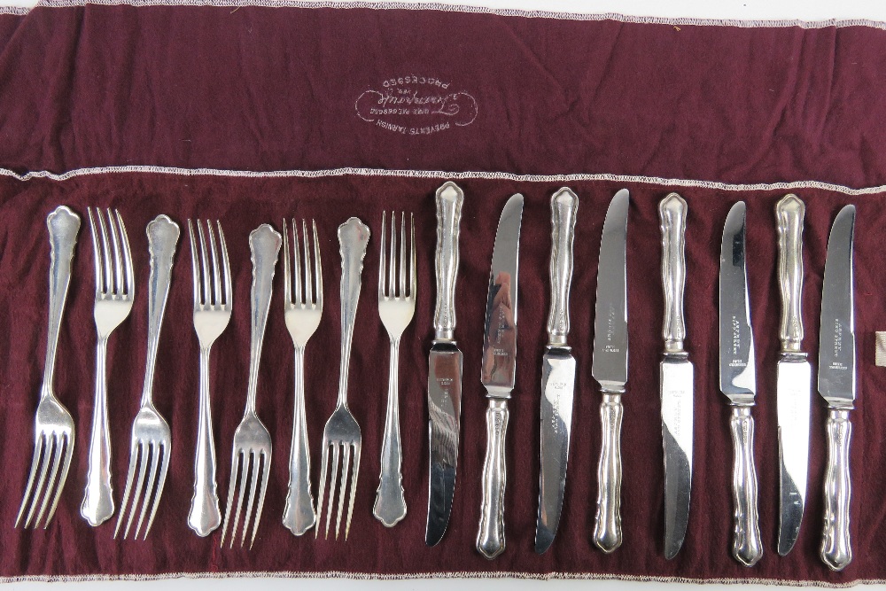 A set of HM silver salad knives and forks for twelve settings by William Hutton & Sons Ltd,