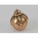 Freemasonry; a 9ct rose gold globe cross Masonic orb pendant,