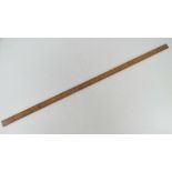 A boxwood yard stick having brass ends made by E Preston & Sons Birmingham.