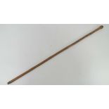 A bamboo swagger stick carved with birds and monkeys upon, 87cm in length.