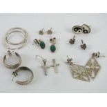 A quantity of silver and white metal earrings including malachite, Yin Yang, hoops, crucifix, etc.