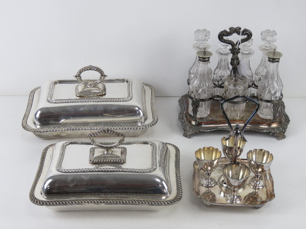 A graduated pair of silver plated lidded tureens,
