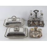 A graduated pair of silver plated lidded tureens,