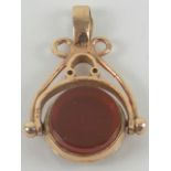 A delightful 9ct rose gold double sided spinning fob pendant set with carnelian and bloodstone,
