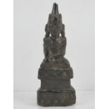 An unusual leather covered wooden shrine figurine, probably Tibetan,