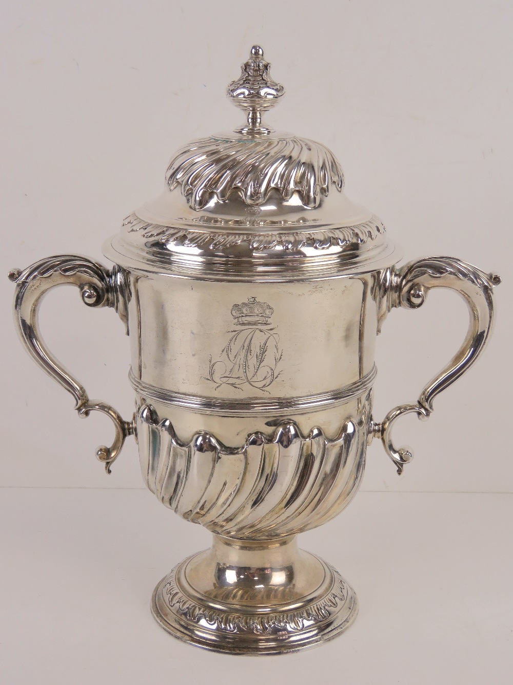 A large and impressive George III HM silver trophy cup having twin acanthus leaf scroll work