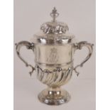 A large and impressive George III HM silver trophy cup having twin acanthus leaf scroll work