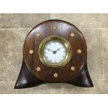 A large laminated mahogany propellor boss having centre mounted clock with Roman numerals apron.