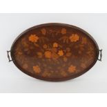 An inlaid mahogany serving tray having intricate floral design, brass end handles,
