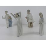 Lladro; Four figurines of children in night clothes, tallest approx 21.5cm high. One hand a/f.