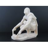 A well carved alabaster sculpture; Grecian school, kneeling man.