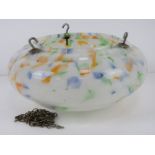 An early 20thC glass hanging lamp shade in mottled white, blue, orange and green,