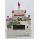 A vintage hand made castle dolls house, 28cm wide.