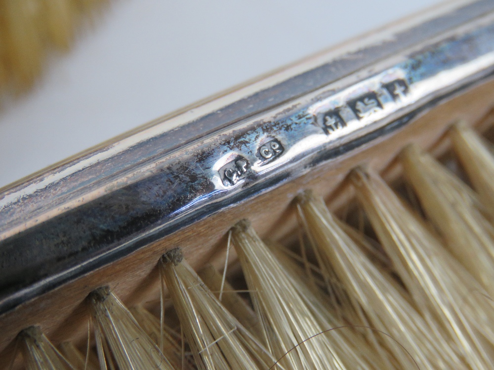 An HM silver dressing table set comprising hair brush and three clothes brushes. - Image 4 of 4