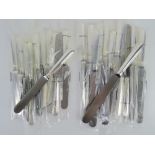 A set of twelve HM silver handled dinner knives,