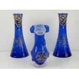 A pair of Bristol Blue glass conical vases having hand painted gilt floral decoration throughout