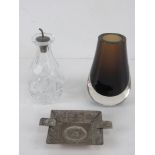 An HM silver oil pouring top with original cork in cut glass bottle.