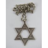 A large HM silver Star of David pendant on white metal chain, pendant 4.8cm inc bale, 17.3g.