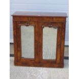 A good walnut half veneered two door floor standing cabinet,