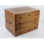 A tabletop chest of four drawers in walnut, collectors / curiosity cabinet,