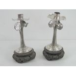 A pair of 19th century Chinese Qing Dynasty silver and wood Lotus flower candlesticks bearing marks