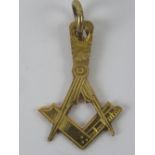 Freemasonry; A square and compasses design pendant, no apparent hallmark, 1g.
