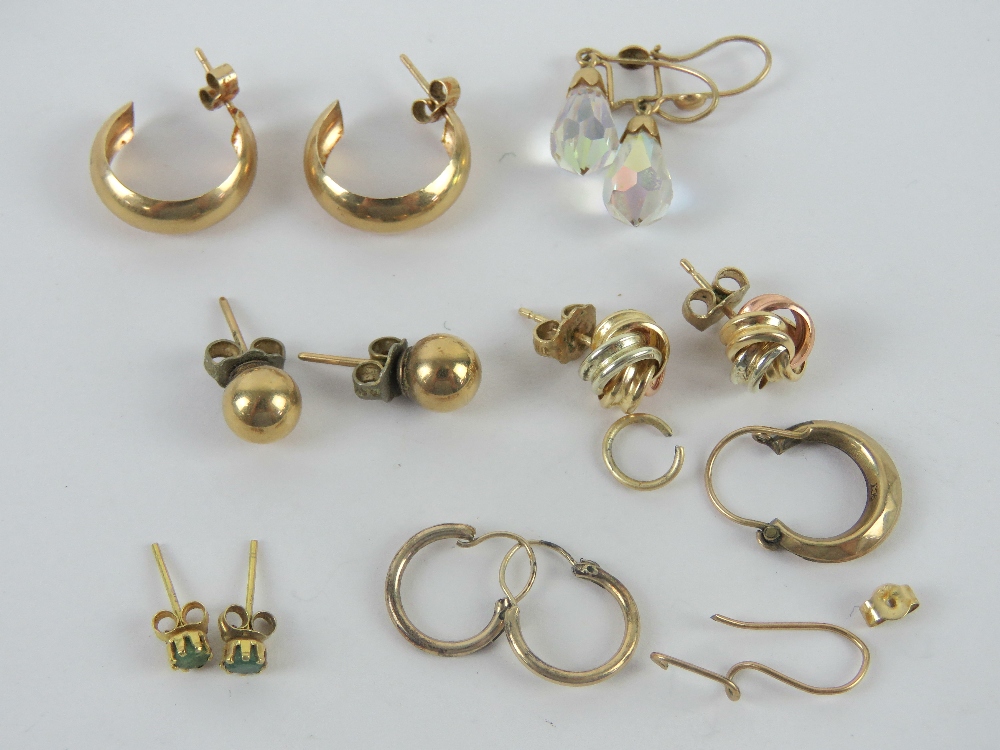 A quantity of 9ct and yellow metal earrings, mostly pairs, total weight 7.5g.