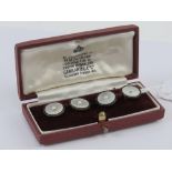 A pair of 9ct gold mother of pearl and seed pearl cuff links presented within Garrard & Co Ltd box,